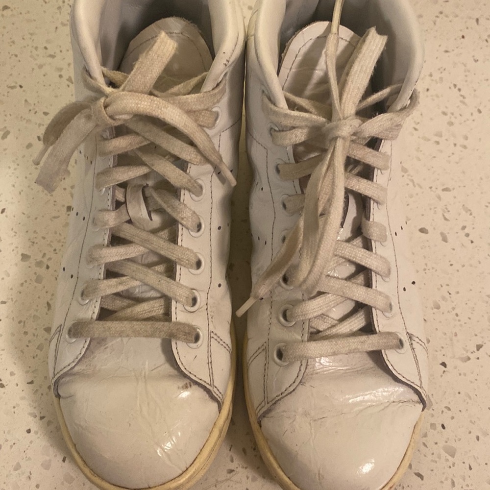 Stan Smith high top embossed sneakers